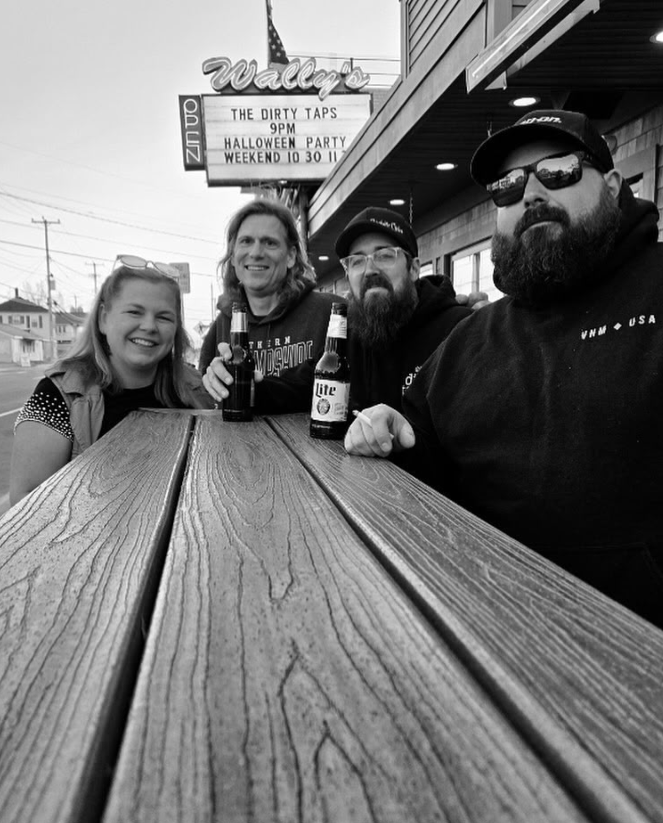 The Dirty Taps Band Sitting outside of Wallys Bar at Hampton Beach